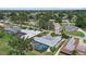 Aerial view of the property showcasing the pool, surrounding landscape, and neighborhood at 538 Magellan Dr, Sarasota, FL 34243
