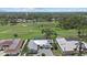 Expansive aerial view of home on golf course, showcasing mature trees and beautiful landscaping at 538 Magellan Dr, Sarasota, FL 34243