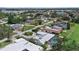 Aerial view of neighborhood showing streets, greenery, and well-maintained homes at 538 Magellan Dr, Sarasota, FL 34243