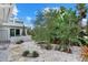 Lush backyard featuring decorative rock landscaping and stepping stone pathway at 538 Magellan Dr, Sarasota, FL 34243