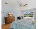 This is a spacious bedroom overlooking a pool area, with modern decor at 538 Magellan Dr, Sarasota, FL 34243
