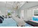 Bedroom featuring access to patio with bright light and an airy feeling at 538 Magellan Dr, Sarasota, FL 34243