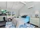 Bright bedroom with a vaulted ceiling, large window and a ceiling fan at 538 Magellan Dr, Sarasota, FL 34243