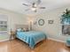 Cozy bedroom with a ceiling fan, featuring a comfortable bed and serene decor for a relaxing ambiance at 538 Magellan Dr, Sarasota, FL 34243