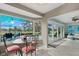 Bright breakfast nook featuring a glass table overlooking the pool and golf course at 538 Magellan Dr, Sarasota, FL 34243