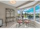 Breakfast nook with charming furnishings and view of screened in patio at 538 Magellan Dr, Sarasota, FL 34243