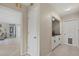 Open hallway featuring white doors, ceramic tile and built in storage at 538 Magellan Dr, Sarasota, FL 34243
