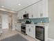 Modern kitchen with white cabinets, sleek appliances, and stylish backsplash at 538 Magellan Dr, Sarasota, FL 34243