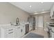 Well-lit kitchen with stainless steel appliances, quartz countertops, and matte black hardware at 538 Magellan Dr, Sarasota, FL 34243
