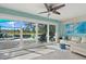 Bright living room with large sliding glass doors leading to the pool area at 538 Magellan Dr, Sarasota, FL 34243