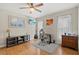 Well-lit office space with a ceiling fan, featuring a TV and comfortable work setup for productivity at 538 Magellan Dr, Sarasota, FL 34243