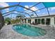 Inviting outdoor pool area with a screened enclosure, comfortable seating, and private yard at 538 Magellan Dr, Sarasota, FL 34243