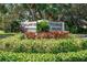 Well-landscaped community entrance sign with lush greenery and vibrant foliage at 548 Lakeside Dr # 0, Bradenton, FL 34210