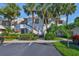 Multi-Gathering building with tropical landscaping, palm trees, and parking spots at 548 Lakeside Dr # 0, Bradenton, FL 34210