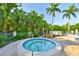 Relaxing spa hot tub surrounded by lush tropical plants and comfortable seating at 548 Lakeside Dr # 0, Bradenton, FL 34210