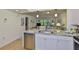 Open concept kitchen with stainless steel appliances, granite counters, and tile floors at 548 Lakeside Dr # 0, Bradenton, FL 34210