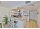 Bright kitchen featuring granite countertops, stainless steel appliances, and a convenient breakfast bar at 548 Lakeside Dr # 0, Bradenton, FL 34210