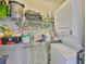 Utility room with stacked washer and dryer and ample storage shelves at 548 Lakeside Dr # 0, Bradenton, FL 34210