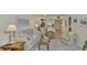 Well-lit living room with comfortable furniture, views, and connection to the kitchen at 548 Lakeside Dr # 0, Bradenton, FL 34210