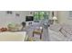 Relaxing living room featuring carpet and views from the windows at 548 Lakeside Dr # 0, Bradenton, FL 34210