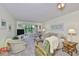 Comfortable living room with neutral paint, carpet, and view to the outdoors at 548 Lakeside Dr # 0, Bradenton, FL 34210