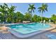 Sparkling outdoor pool surrounded by lush landscaping and comfortable lounge chairs at 548 Lakeside Dr # 0, Bradenton, FL 34210