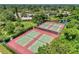 Aerial view of well-maintained community tennis courts surrounded by lush greenery and landscaping at 548 Lakeside Dr # 0, Bradenton, FL 34210