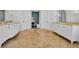 Elegant bathroom with marble floors, dual vanities with decorative mirrors, and neutral color scheme at 550 Dove Pointe, Osprey, FL 34229