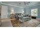 Comfortable bedroom featuring a blue accent wall, a couch, and soft natural light at 550 Dove Pointe, Osprey, FL 34229