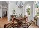 Elegant dining area with a traditional table, and a large window with views of lush greenery at 550 Dove Pointe, Osprey, FL 34229