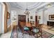 Spacious dining room featuring a chandelier, a long table, and elegant decor at 550 Dove Pointe, Osprey, FL 34229
