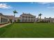 Stunning estate with manicured lawn, and stately architecture at 550 Dove Pointe, Osprey, FL 34229
