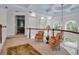 Elegant hallway featuring wood railings, sitting area and decorative details and arched windows at 550 Dove Pointe, Osprey, FL 34229