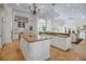 Open kitchen with granite counters, custom cabinets, and access to the dining and living area at 550 Dove Pointe, Osprey, FL 34229