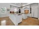 Spacious kitchen boasting white cabinetry, granite countertops, and dual islands for cooking and gathering at 550 Dove Pointe, Osprey, FL 34229