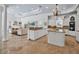 Open-concept living space with a kitchen, a living room with comfortable seating, and plenty of natural light at 550 Dove Pointe, Osprey, FL 34229