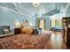 Expansive main bedroom with blue walls, unique ceiling, and cozy sitting area at 550 Dove Pointe, Osprey, FL 34229