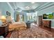 Spacious main bedroom with detailed ceilings, large windows, and a comfortable layout at 550 Dove Pointe, Osprey, FL 34229