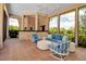 Inviting covered lanai with comfortable seating and outdoor bar area at 550 Dove Pointe, Osprey, FL 34229