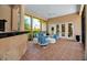 Covered lanai with bar, lounge seating, and access to the main house at 550 Dove Pointe, Osprey, FL 34229