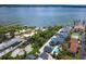 Aerial view of home near the water, surrounded by lush green vegetation at 6005 N Beach Rd # 16, Englewood, FL 34223
