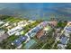 An aerial shot of a waterfront house with lush vegetation and calm blue waters at 6005 N Beach Rd # 16, Englewood, FL 34223