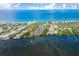 Aerial view of a home near the water and beach with mature landscaping at 6005 N Beach Rd # 16, Englewood, FL 34223