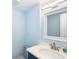 Neat half bath features a sleek vanity, a modern faucet, and crisp lighting perfect for a quick refresh at 6005 N Beach Rd # 16, Englewood, FL 34223