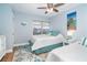 Cozy bedroom with matching twin beds, cheerful turquoise accents, and nautical wall art, creating a serene coastal retreat at 6005 N Beach Rd # 16, Englewood, FL 34223