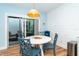 Charming dining area featuring shiplap wall, hardwood floors, and access to the outdoor patio at 6005 N Beach Rd # 16, Englewood, FL 34223
