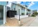 Stylish condo showcasing a screened in porch, a white picket fence, and attractive landscaping at 6005 N Beach Rd # 16, Englewood, FL 34223