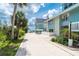 Inviting waterfront condo featuring a private walkway and a calming light blue exterior at 6005 N Beach Rd # 16, Englewood, FL 34223