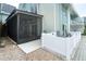 Exterior view featuring screened in porch and fenced patio at 6005 N Beach Rd # 16, Englewood, FL 34223