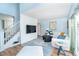 Bright living area features a staircase, stylish nautical decor, and a large flat screen TV, perfect for a relaxing entertainment space at 6005 N Beach Rd # 16, Englewood, FL 34223
